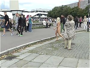 blond Czech teenager demonstrating her torrid figure naked in public